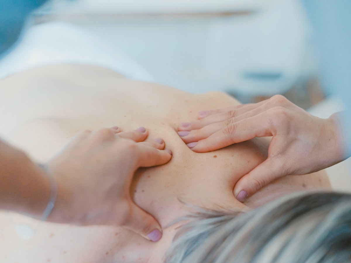 A client receiving a back and shoulder massage